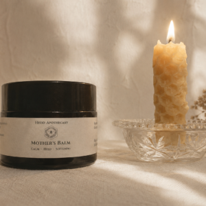 Hedd Mother's Balm paired with a beeswax candle
